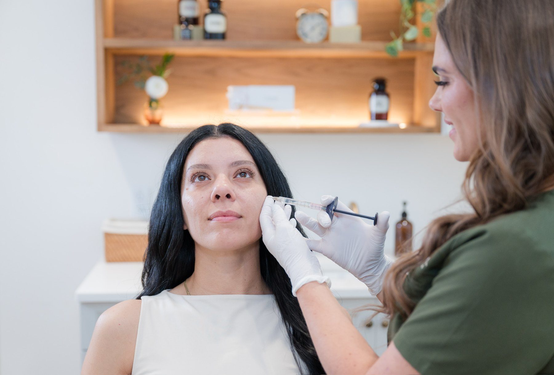 Elixir Aesthetics provider preparing an injectable treatment for Botox and fillers