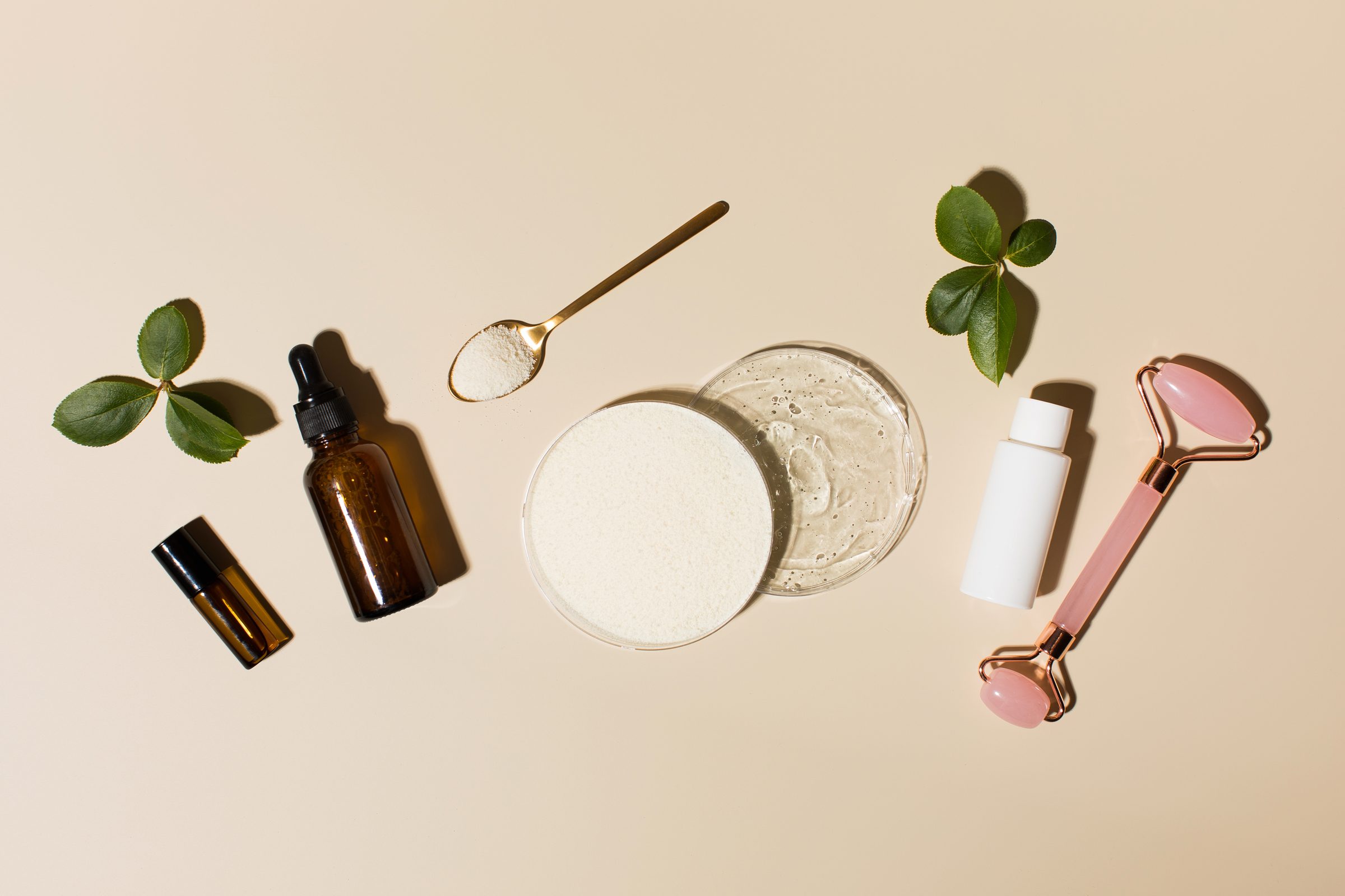 Collagen and hyaluronic skincare products arranged on a clean surface